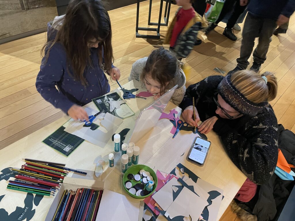 Children and parents crafting in the museum.